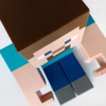 Toy figurine of a Minecraft character.