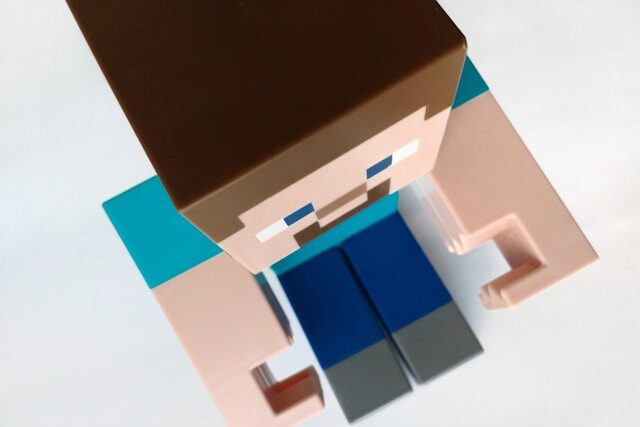 Toy figurine of a Minecraft character.